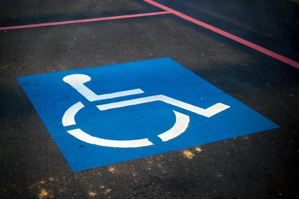 A disabled parking symbol in a parking space